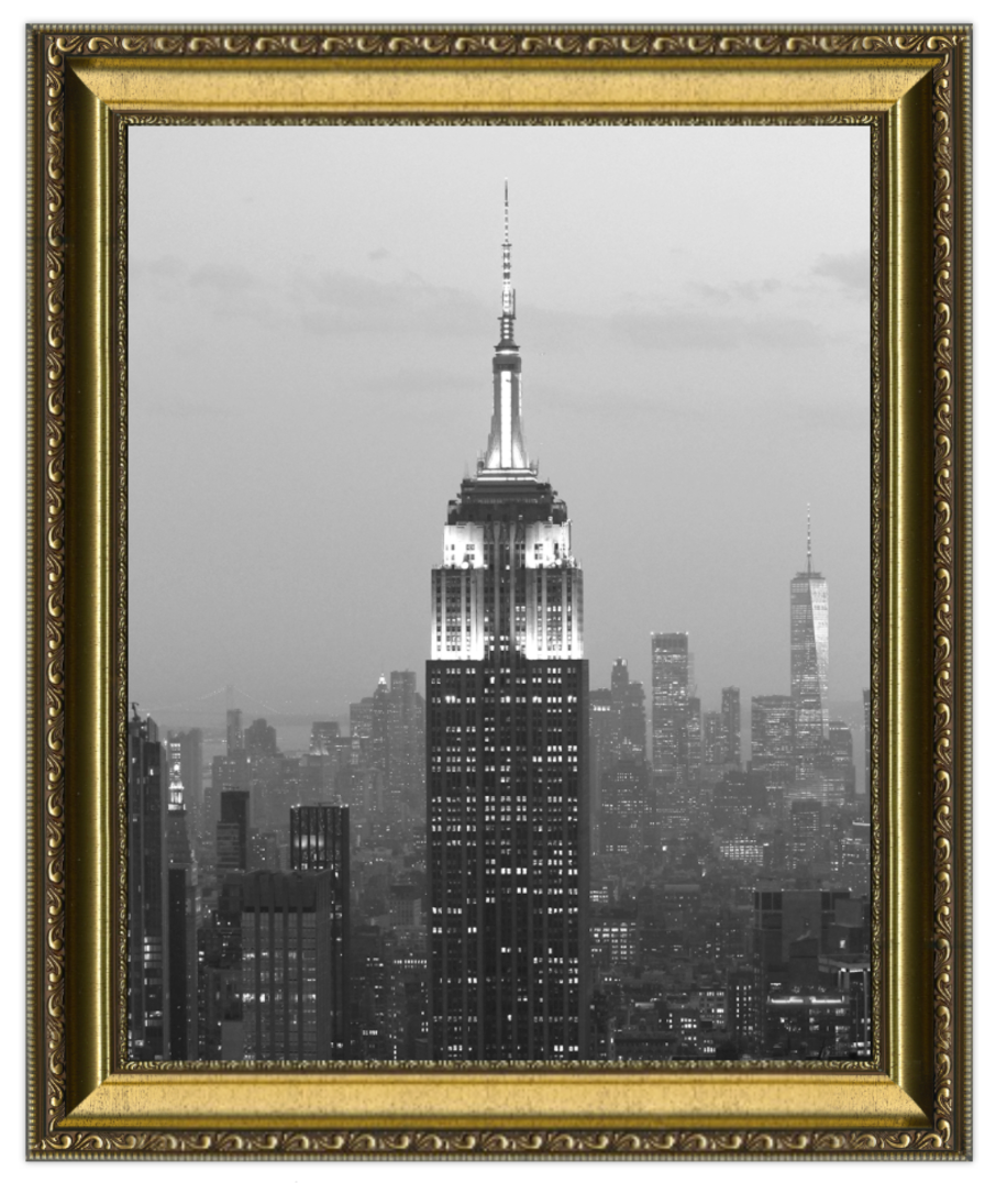 Framed black and white photo of a city skyline with a prominent skyscraper.