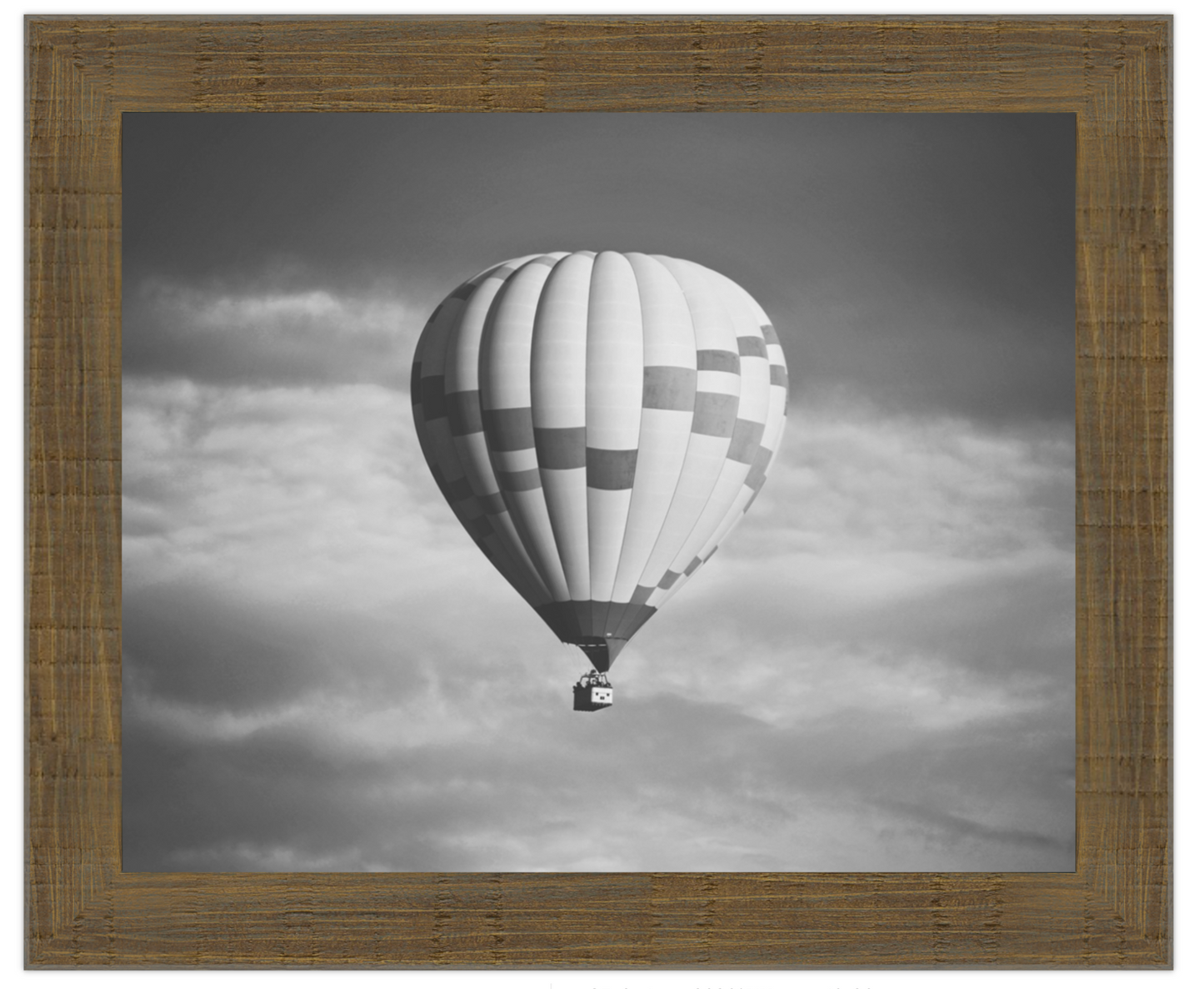 Hot air balloon in a cloudy sky with a wooden frame