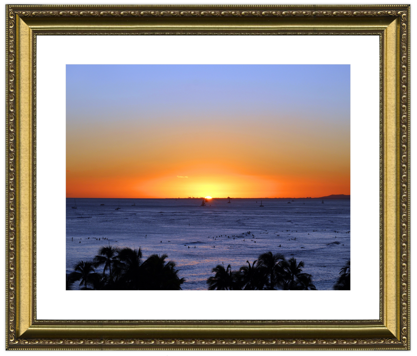 Sunset over the ocean with palm trees in the foreground, framed in gold.
