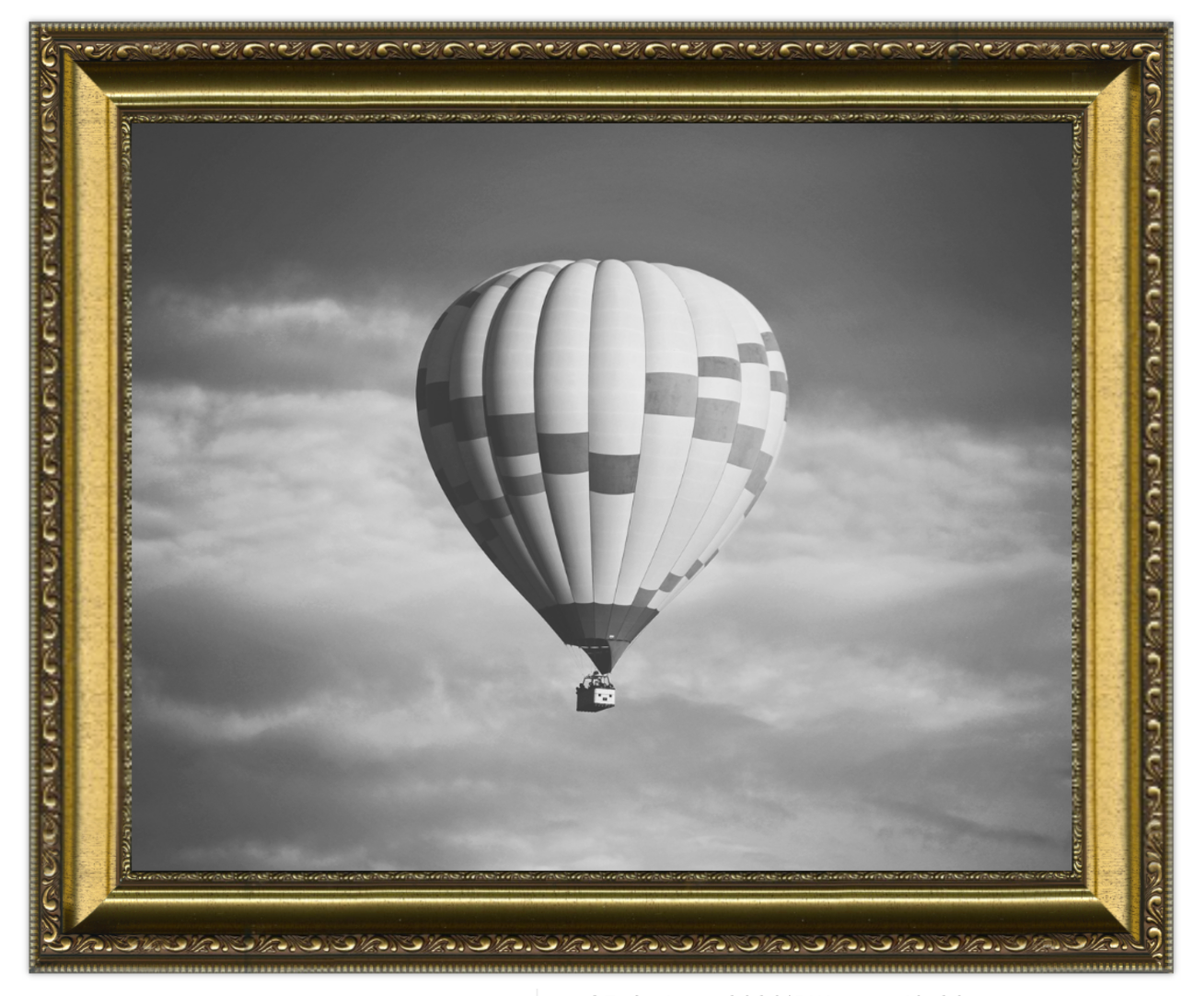 Hot air balloon in a cloudy sky with a gold ornate frame.