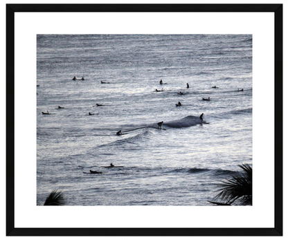 Framed artwork of ocean with surfers