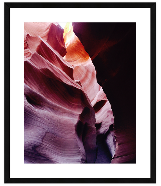Framed photograph of a sandstone formation with wavy patterns.