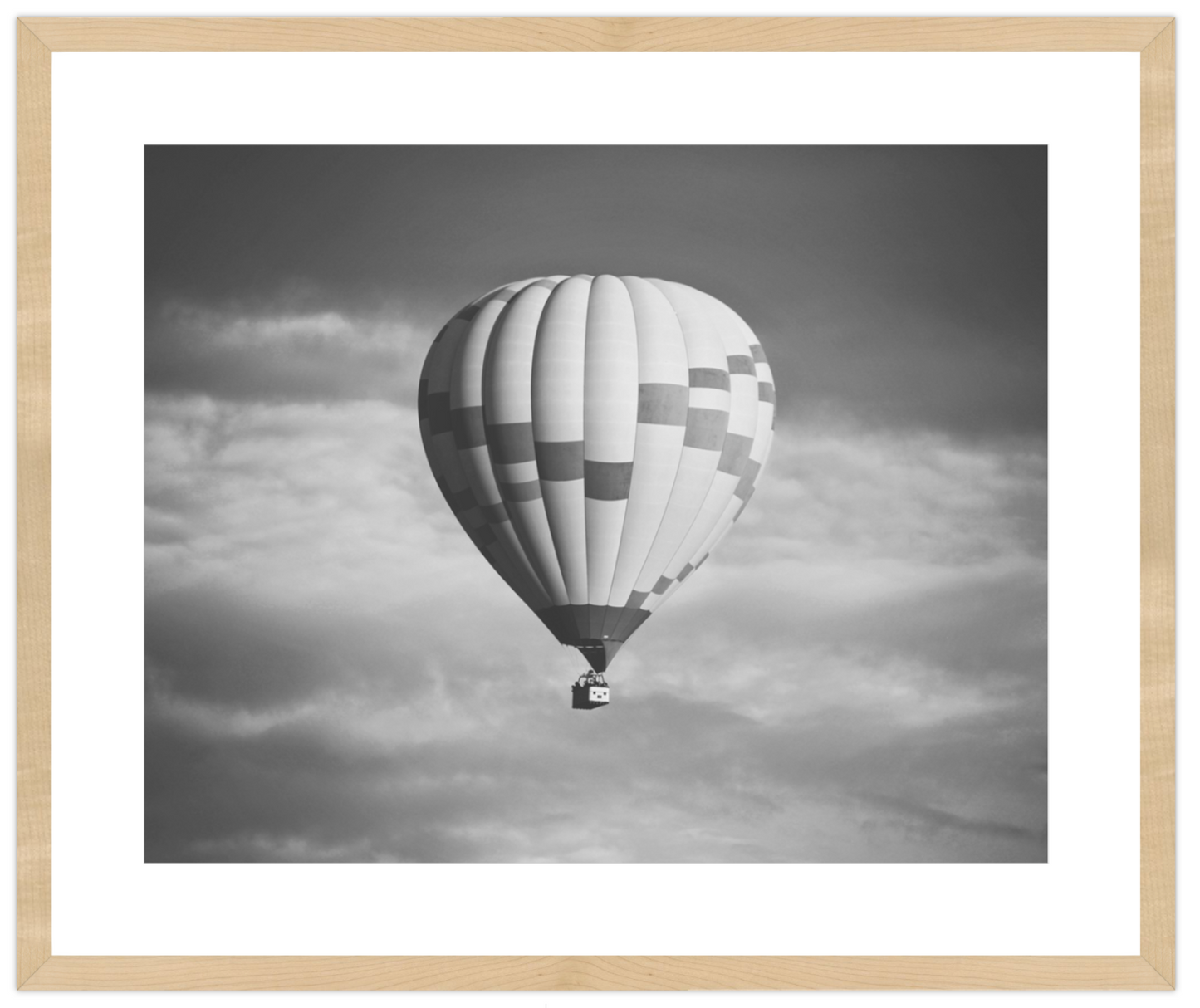 Hot air balloon in a cloudy sky with a wooden frame
