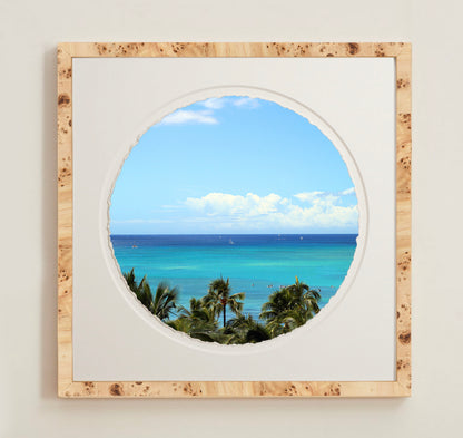 A collection of framed artwork prints with a deckled edge appearance, displayed in two museum style frames named Light Burlwood and Dark Burlwood. The frames are pictured in various sizes with a white mat and clear acrylic front.
