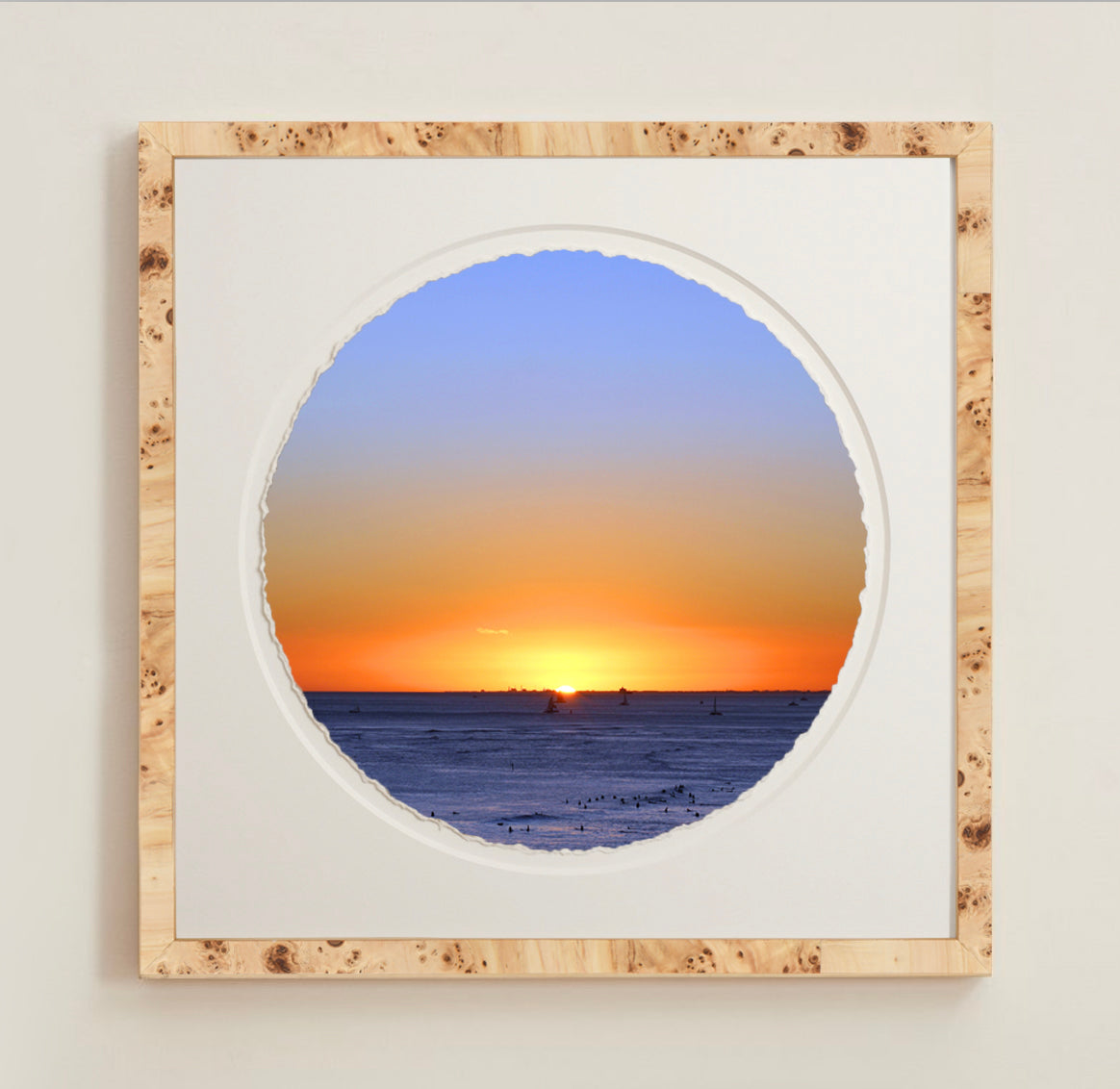 A collection of framed artwork prints with a deckled edge appearance, displayed in two museum style frames named Light Burlwood and Dark Burlwood. The frames are pictured in various sizes with a white mat and clear acrylic front.