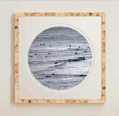 A collection of framed artwork prints with a deckled edge appearance, displayed in two museum style frames named Light Burlwood and Dark Burlwood. The frames are pictured in various sizes with a white mat and clear acrylic front.