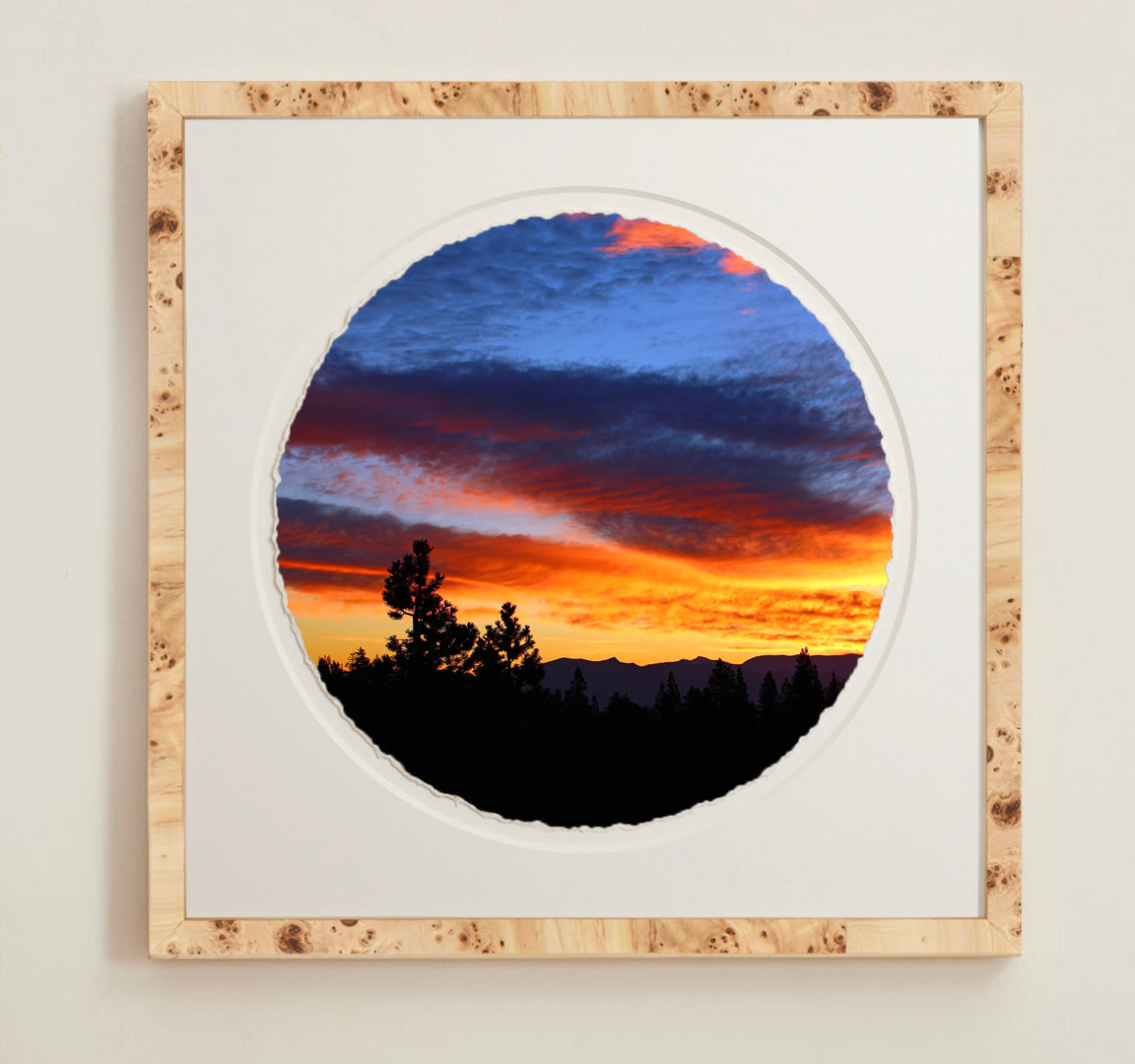 A collection of framed artwork prints with a deckled edge appearance, displayed in two museum style frames named Light Burlwood and Dark Burlwood. The frames are pictured in various sizes with a white mat and clear acrylic front.