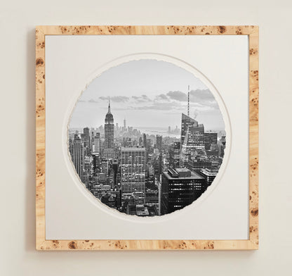 A collection of framed artwork prints with a deckled edge appearance, displayed in two museum style frames named Light Burlwood and Dark Burlwood. The frames are pictured in various sizes with a white mat and clear acrylic front.