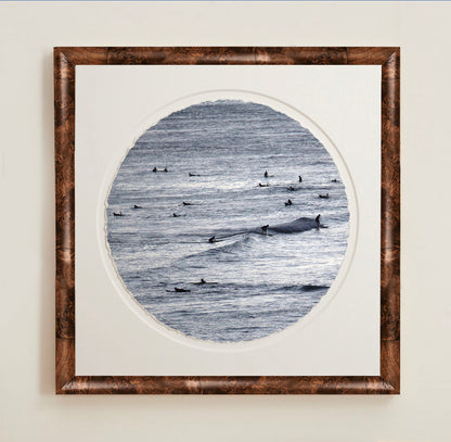 A collection of framed artwork prints with a deckled edge appearance, displayed in two museum style frames named Light Burlwood and Dark Burlwood. The frames are pictured in various sizes with a white mat and clear acrylic front.